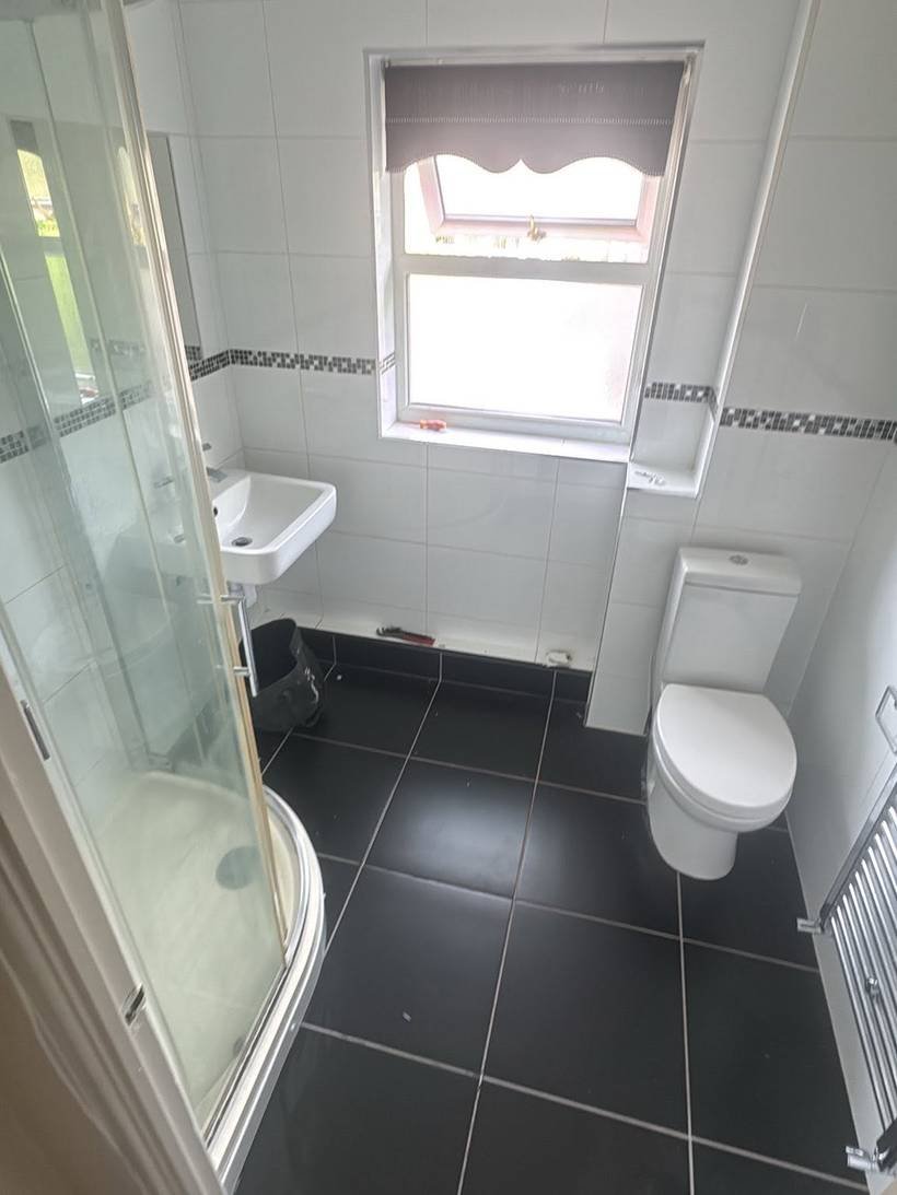Before: Corner shower room to a freestanding bath